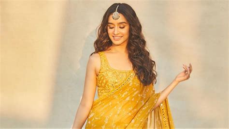 A celeb-inspired styling guide to wearing yellow saris to a spring wedding