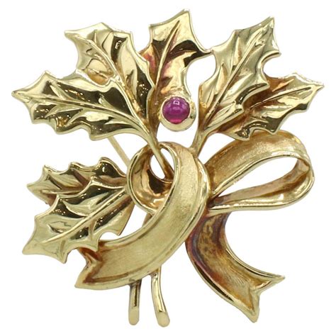 Tiffany and Co. 18 Karat Yellow Gold Holly Leaf Ruby Ribbon Pin Brooch For Sale at 1stDibs