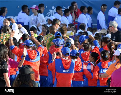 The Cuban delegation enters the Coliseum as part of the parade of ...