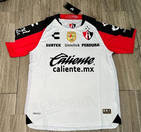 Atlas Away football shirt 2022 - 2023. Sponsored by Caliente