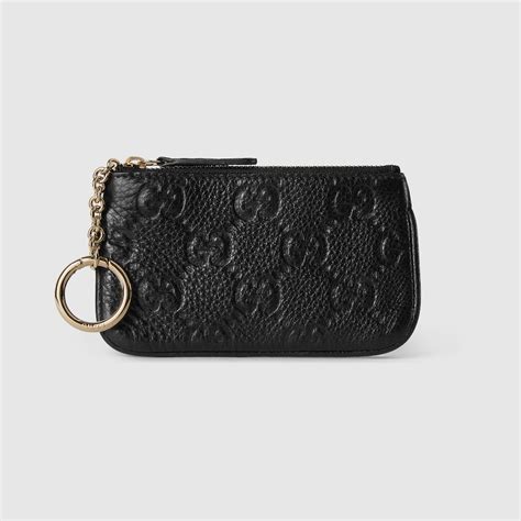 GG Emblem key pouch in black leather | GUCCI® UK