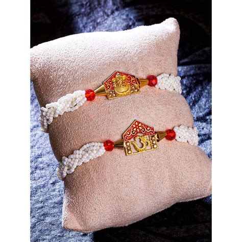 Buy Sukkhi Amazing Gold Plated Ganesh & Om Rakhi Roli Chawal and ...