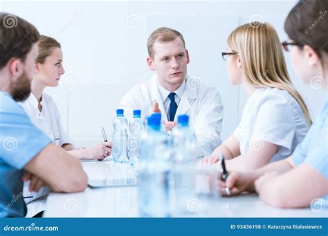 Conference with Doctors in Medical Aprons Stock Photo - Image of live, consultation: 93436198