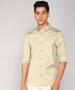 Calvin Klein Jeans Men Solid Casual Beige Shirt - Buy Calvin Klein ...