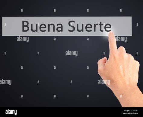 Buena Suerte ( Good Luck in Spanish) - Hand pressing a button on ...