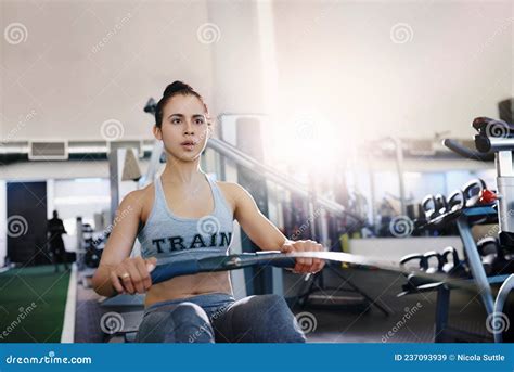 Burn Calories and Build Muscles with a Rowing Machine Stock Image ...