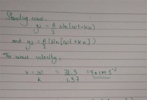 two travelling waves of equal amplitude and equal frequencies move in ...