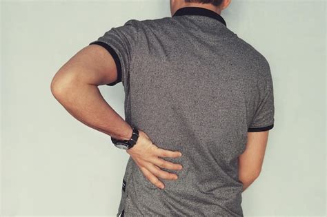 Image of man suffering back pain against blue background renal failure ...
