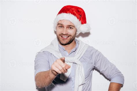 Merry Christmas to you Handsome young man in Santa hat pointing you and ...