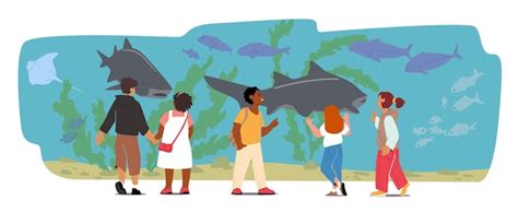 Dzieci w oceanarium, dzieci patrzące na ryby oceaniczne za szkłem ...