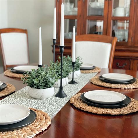Black and White Plates on Woven Chargers with Succulent Centerpieces ...