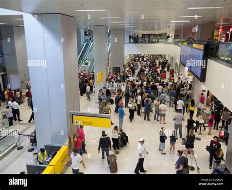 People await the arrival of passengers, arrivals area, Terminal 3 ...