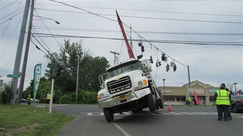 Sign truck's crane-like boom damages traffic lights in Salina ...