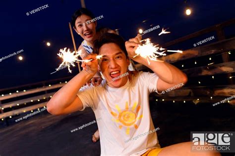 Young lovers set off fireworks, Stock Photo, Picture And Royalty Free ...