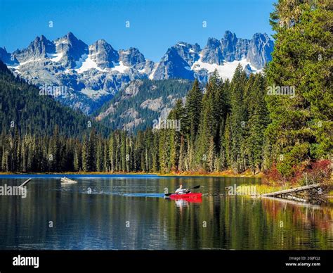 USA, Washington State, Cle Elum, Kittitas County. Red canoe on Cooper ...