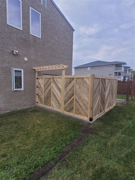 I made this privacy fence out of pallets and reclaimed limber. turned ...