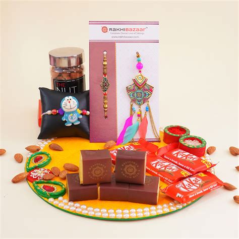 Send Doraemon Kids Rakhi N Couples Rakhi with Puja Thali Gift Hamper ...