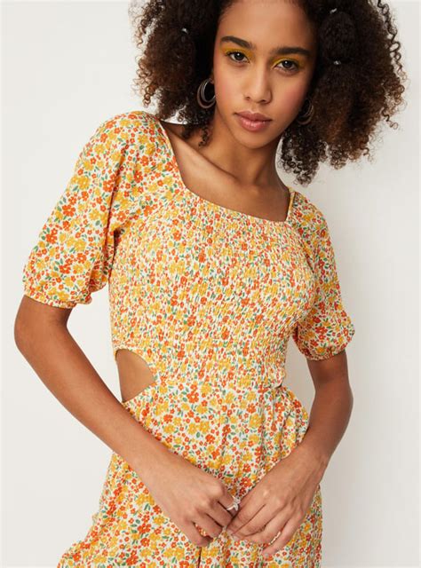Buy Women Floral Printed Cut-Out Playsuit Online at just Rs. 999.0 ...