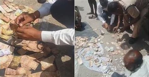 Video: Policemen help homeless man dry his bundled up currency bills ...