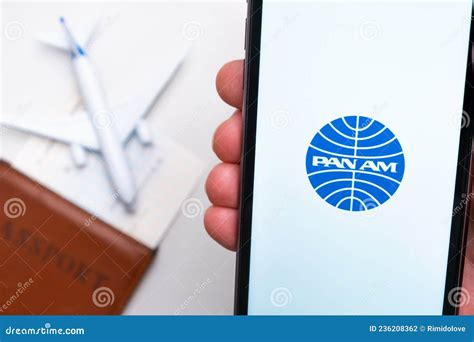Pan am Airline Logo on the Mobile Phone Screen with a Plane, Passport ...