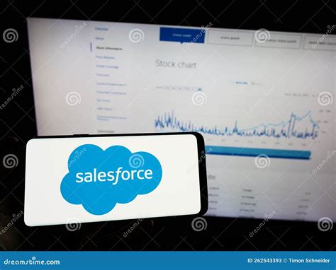 Person Holding Mobile Phone with Logo of American Software Company ...