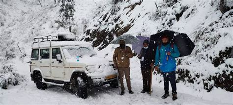 In pics: Poll officials brave harsh weather to reach booths in Uttarakhand