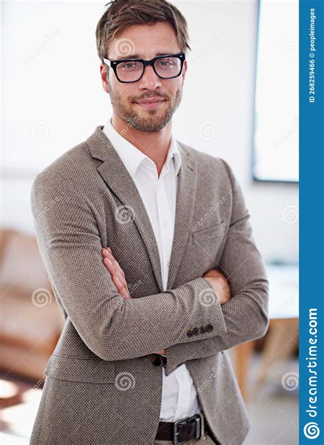 Taking His Success in Stride. Portrait of a Young Man Standing in an ...