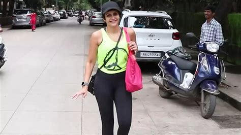 50-year-old Mandira Bedi dons a neon green tank top paired with black ...