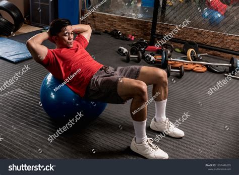 Swiss Ball Crunch With Weight