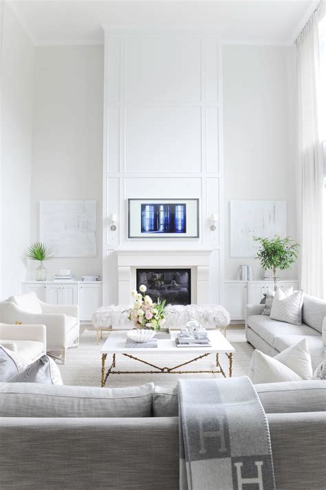 Vancouver home with all white color scheme + millwork on the fireplace ...