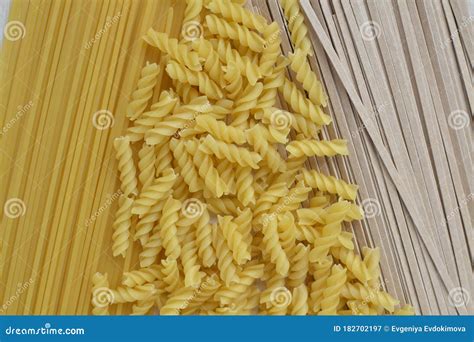 Spiral Pasta is Scattered on Wheat Spaghetti and Buckwheat Noodles ...