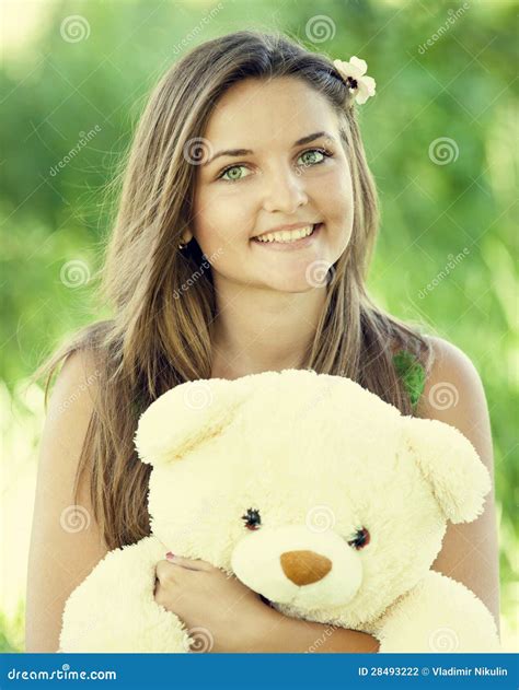 Beautiful Teen Girl with Teddy Bear in the Park at Green Grass. Stock ...
