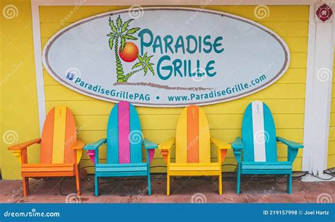 Colorful Beach Chairs Sit Under the Paradise Grill Sign in Pass a ...