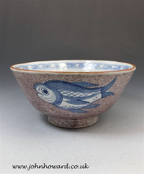 English delftware pottery bowl with manganese ground decorated with ...