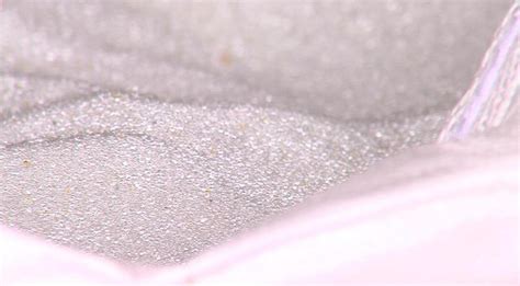 Glass beads put in grooves help keep road stripes visible to drivers ...