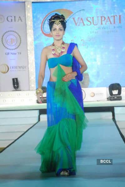 A model showcases jewellery creation by by All India Gems and Jewellery ...