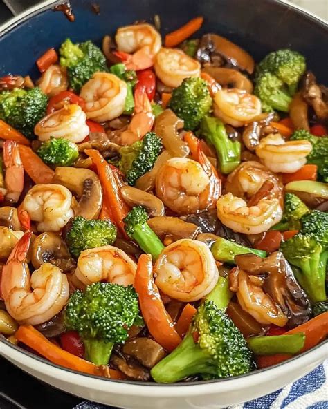 https://friendlywell.com/wp-content/uploads/2025/05/Shrimp_and_Vegetable_Stir-Fry_-1.webp
