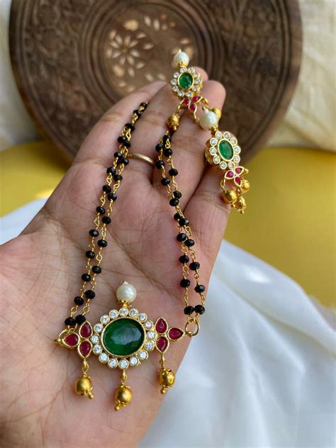 Emerald stone black bead mangalsutra with studs – House of Jhumkas