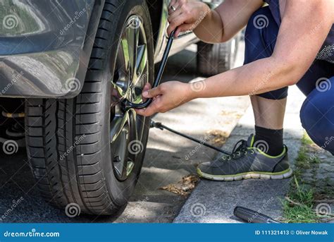 Changing tires on a car stock image. Image of driving - 111321413
