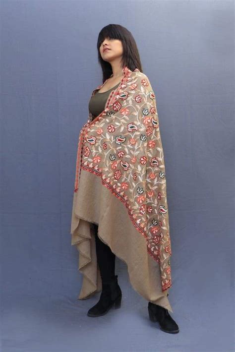 Fawn colour shawl with amazing all over jaal is a perfect blend