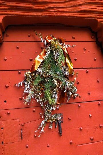 Old metal door with studs in the shape of a pyramid with a christmas ...