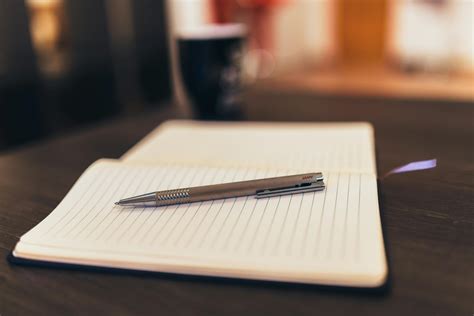 Pen on Notepad Paper · Free Stock Photo