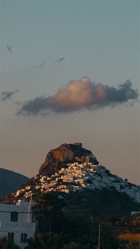 Download wallpaper 1350x2400 mountain, city, buildings, sky, cloud ...
