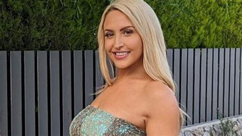 Glamorous BBC presenter Emma Louise Jones looks stunning in tight floral-print dress for friend ...