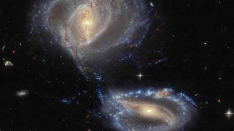 Hubble captures galactic dance as three galaxies collide in deep space ...