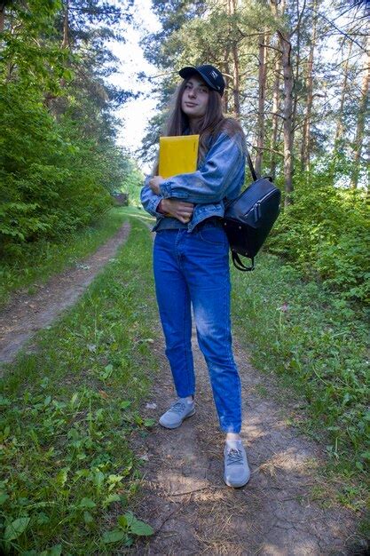 Premium Photo | Young female student with blue eyes folder and backpack ...
