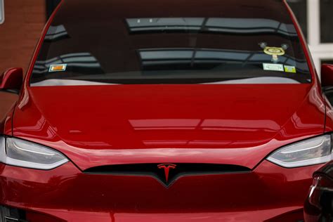 Red Teslas costs more now, but people will still pay for the paint ...