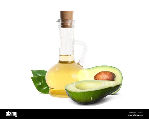 Cooking oil and ripe avocados on white background Stock Photo - Alamy