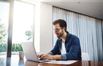 Businessman laptop and documents for communication research and ...