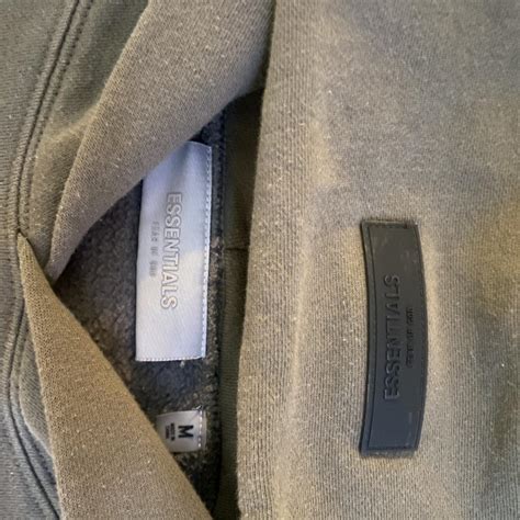 Khaki / green Fear of God Essentials hoodie size M... | Depop